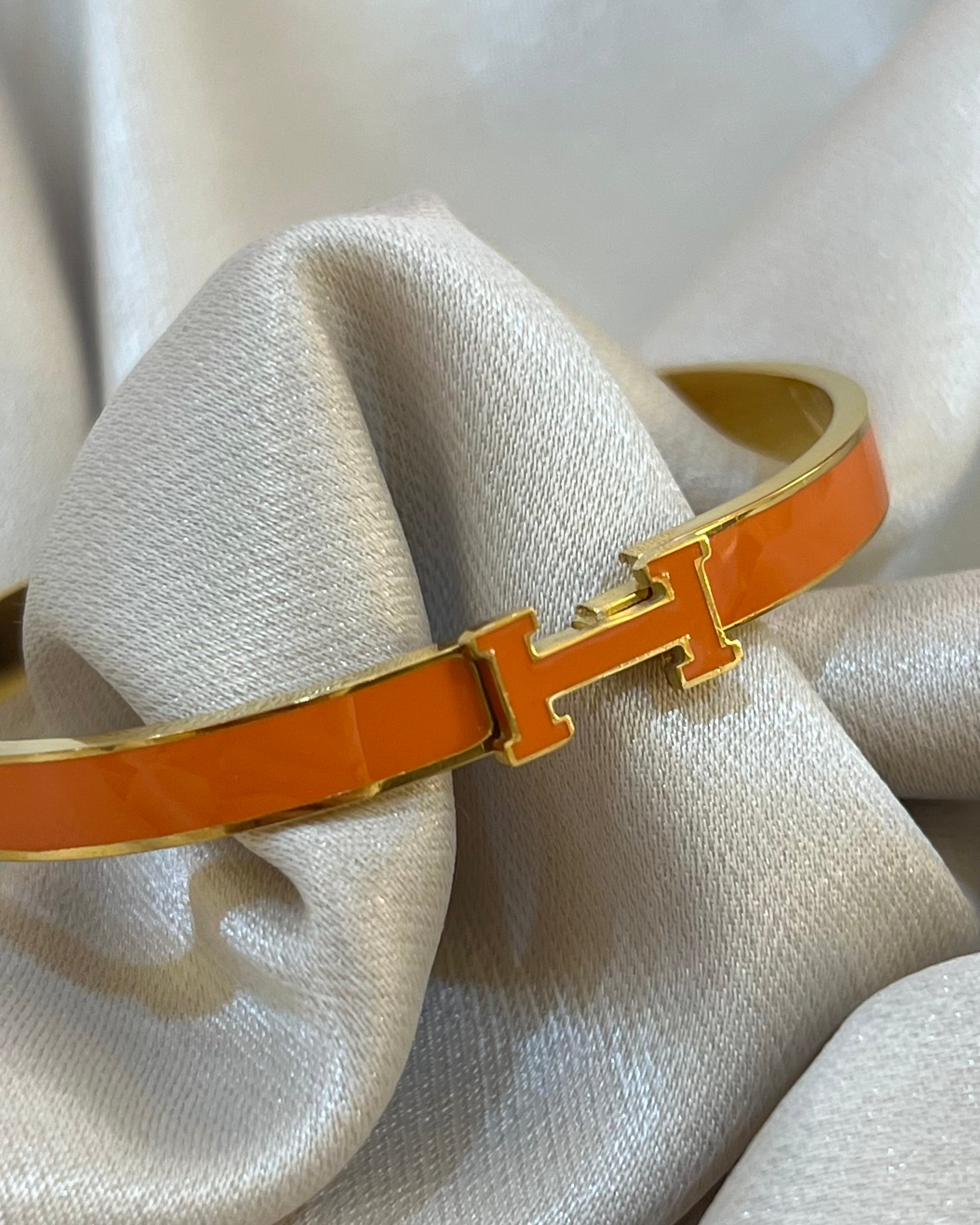 BRACELET H ORANGE EN ACIER INOXYDABLE